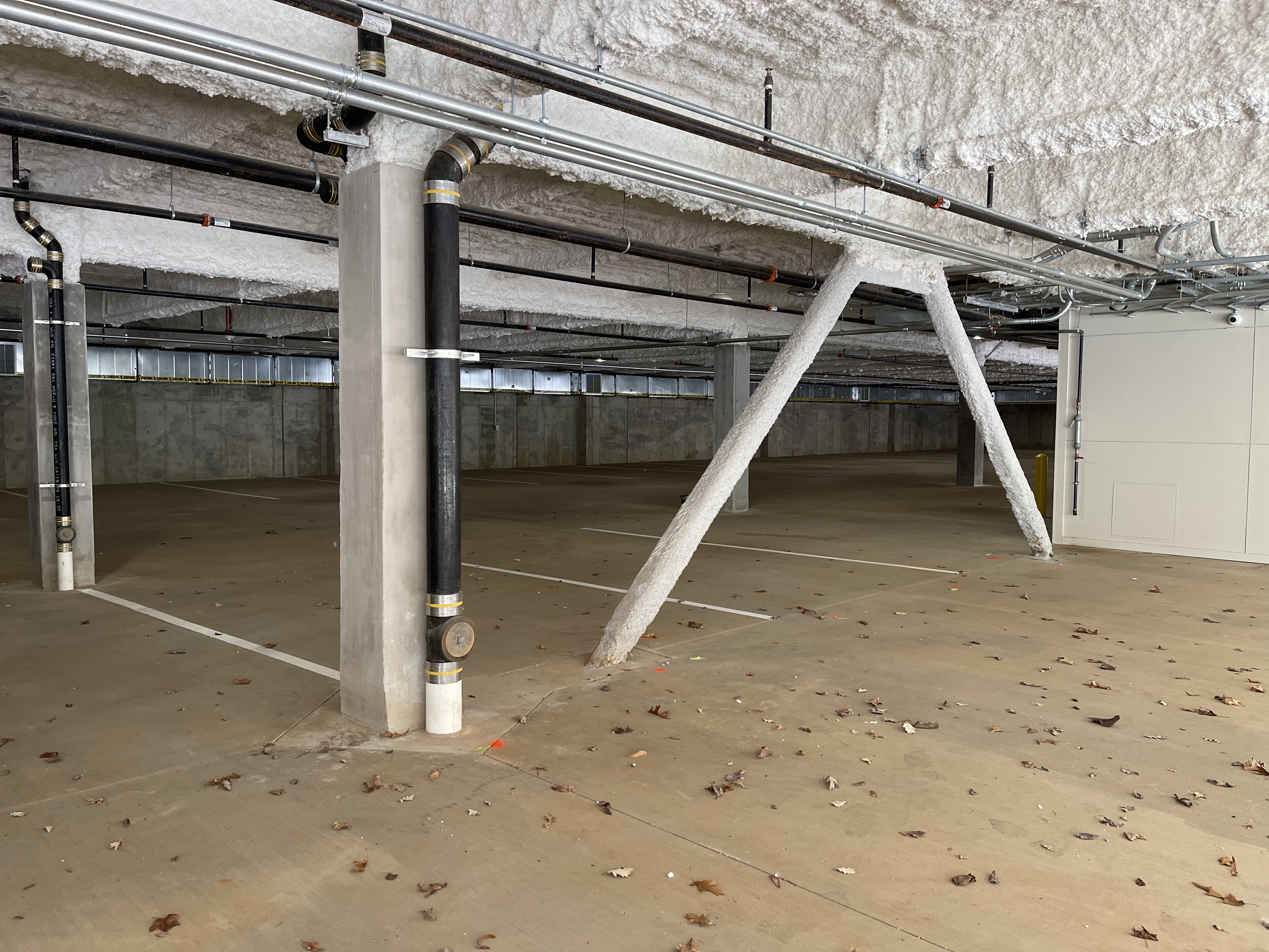 Parking garage before bollard installation showing exposed structural columns