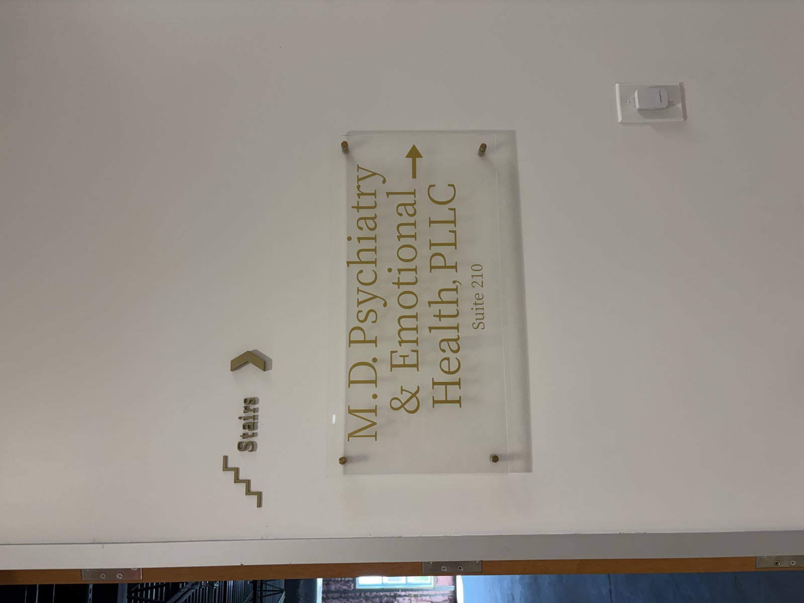 Dimensional acrylic suite plaque with raised Stairs wayfinding lettering